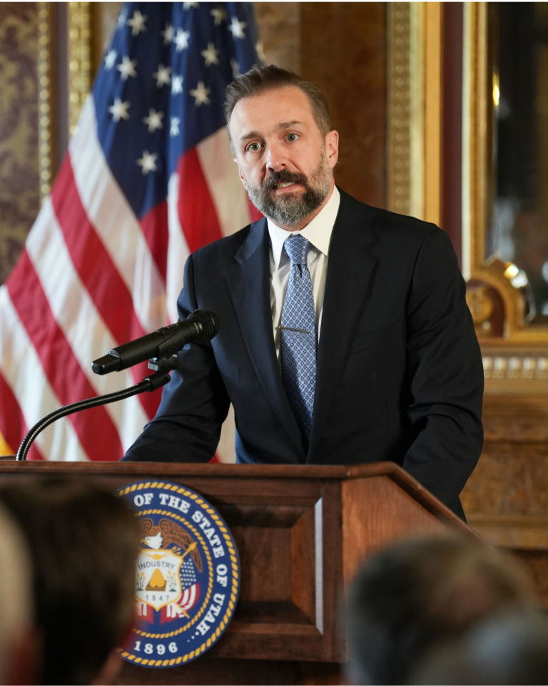 Utah System of Higher Education Commissioner Geoffrey Landward speaks at the Higher Education Resolution signing ceremony at the Utah State Capitol, highlighting Utah's model for collaboration between state government and higher education institutions.