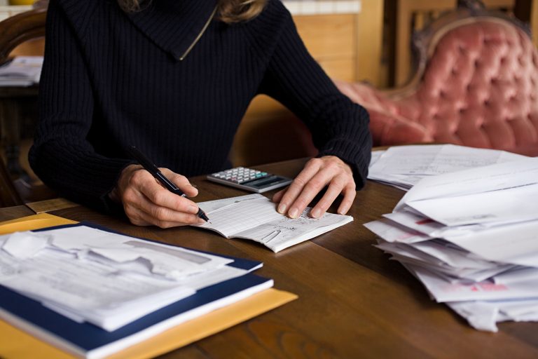 Senior woman working on her finances